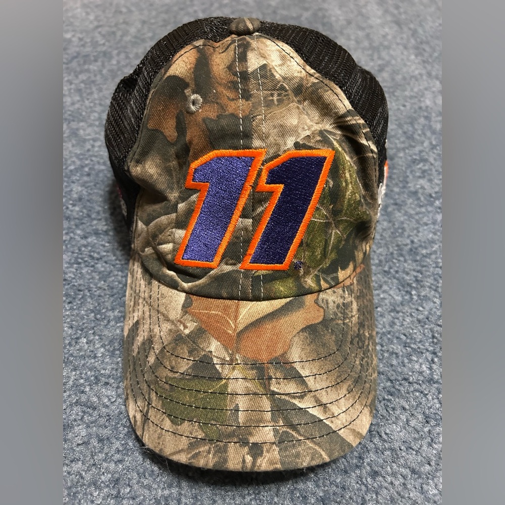 NASCAR  Joe Gibbs Racing Camo hat with purple 11 embroidered with orange trim.